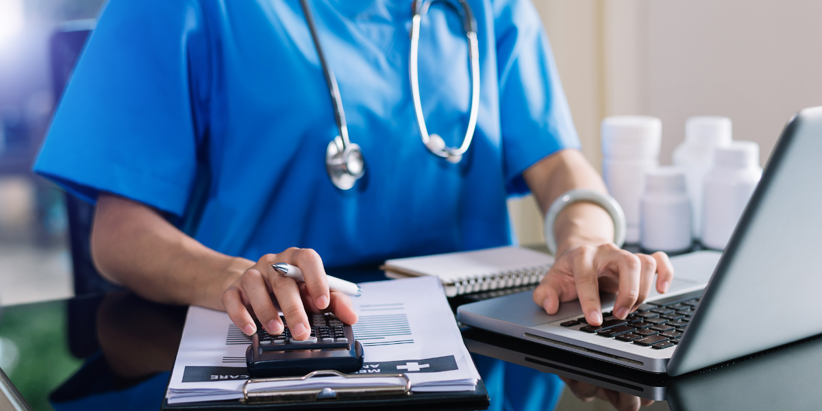 Doctor in uniform on the laptop