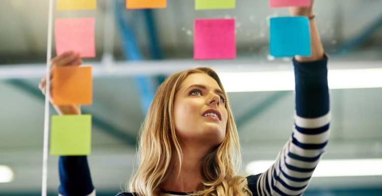 Woman deciding between post it notes