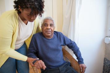 Woman caring for an elderly person